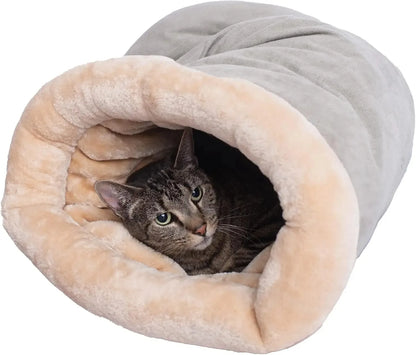 Cat resting in the gray cave bed