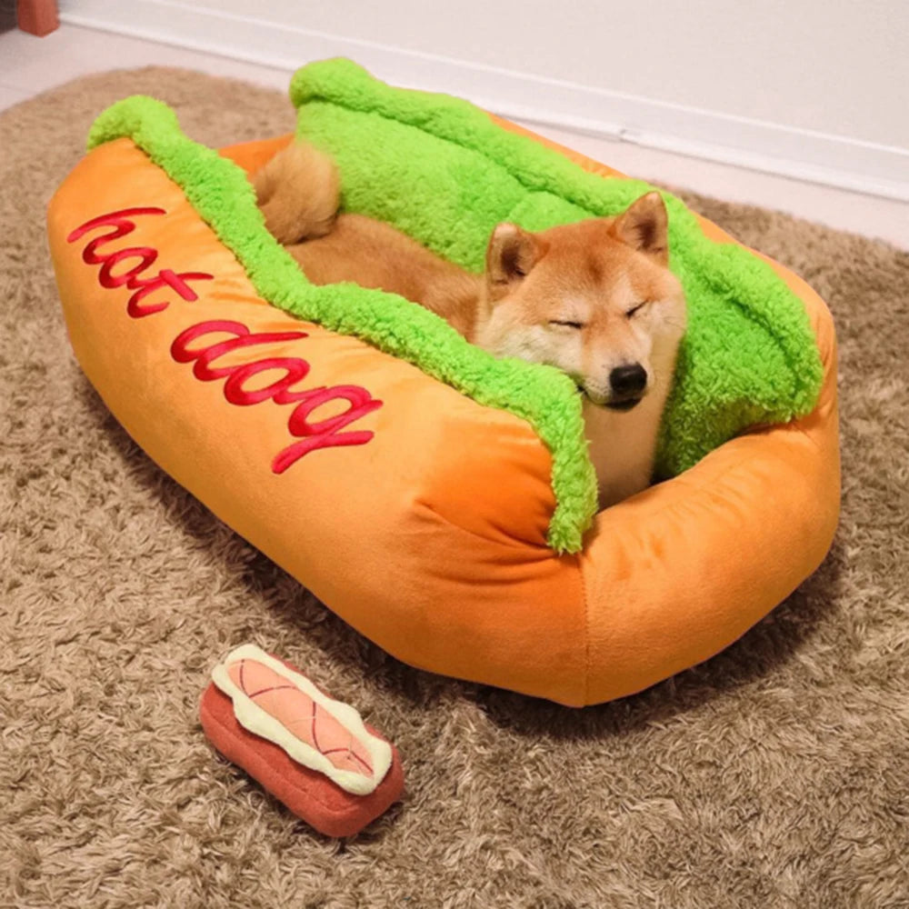 Dog sleeping in the novelty hot dog bed