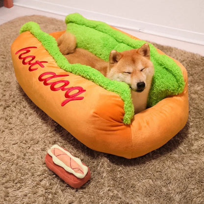 Dog sleeping in the novelty hot dog bed